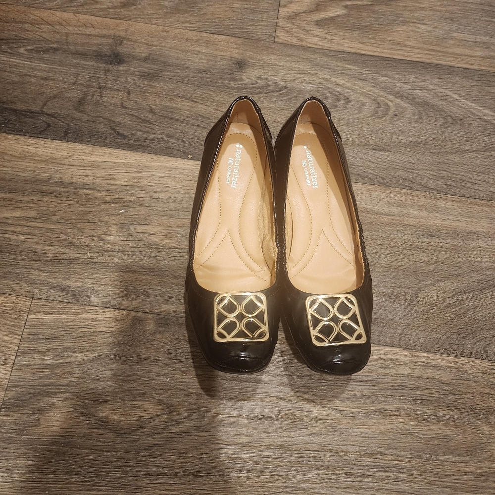 Black faux patent leather ballet flat.